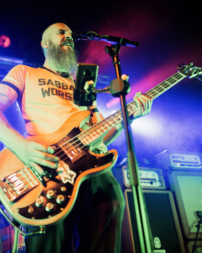 Low angle view of Dopelord bassist performing in London
