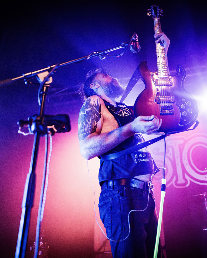 Low angle view of Dopelord guitarist performing in London
