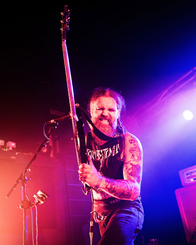 Low angle view of Dopelord guitarist performing in London