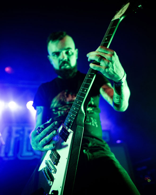 Low angle view of Dopelord guitarist performing in London