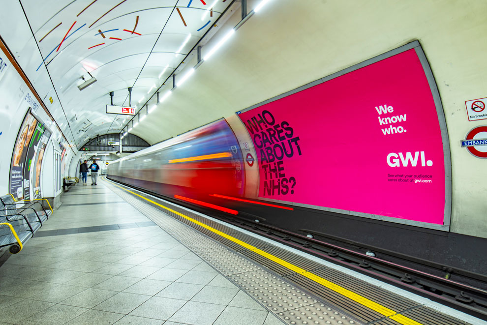 Advertising on the tube, a large billboard with a tube train rushing past.