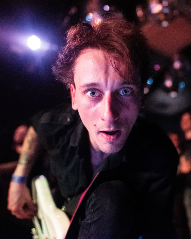 Close up of Urzah bassist looking into the camera