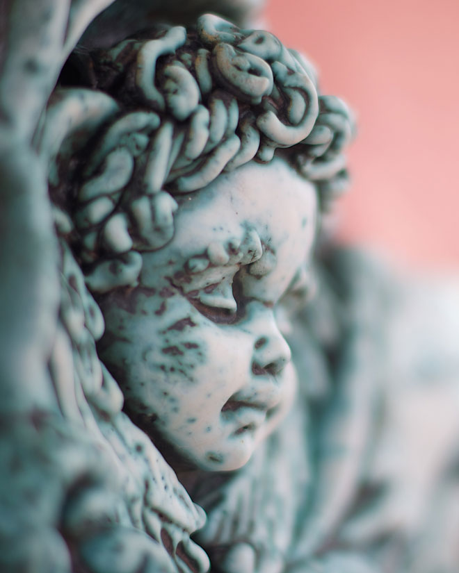 Close up of a cherub sculpture on a church in Cuba
