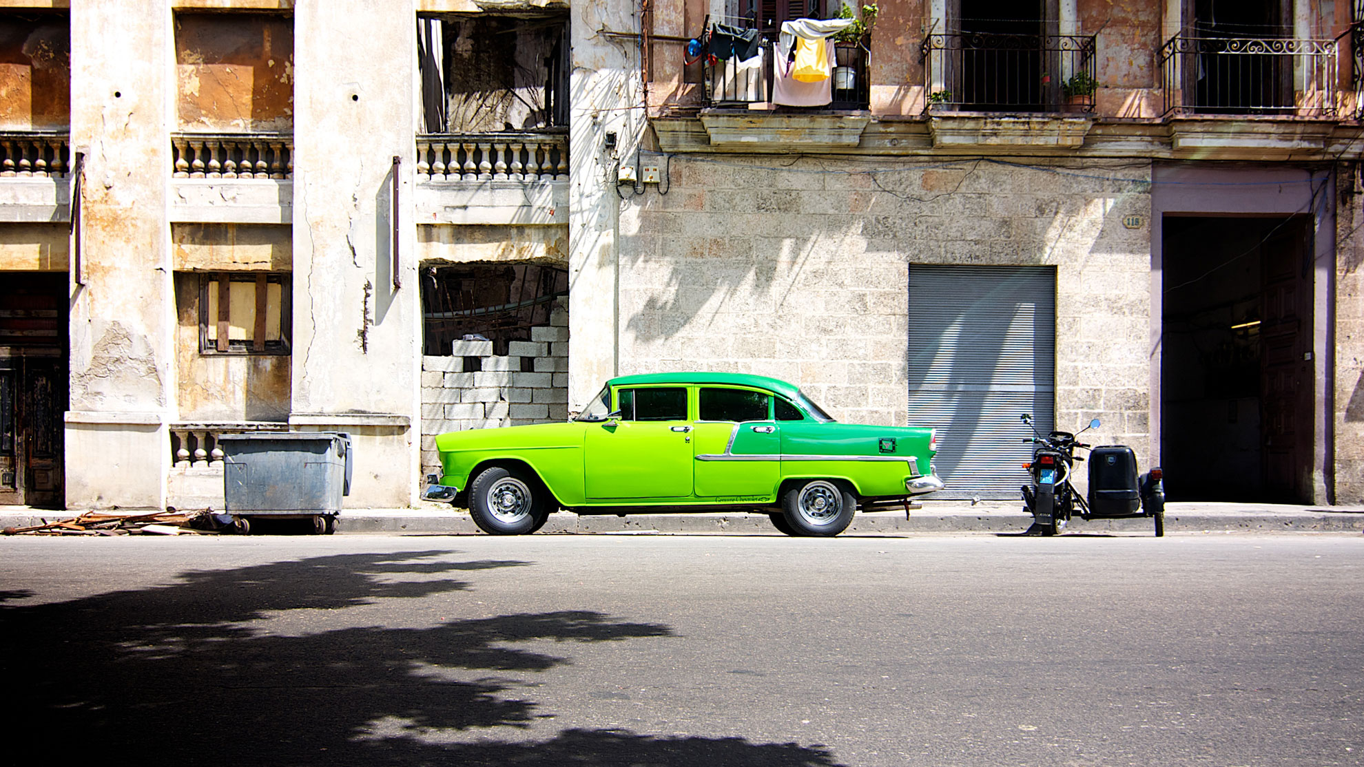 Green classic car in Cuba