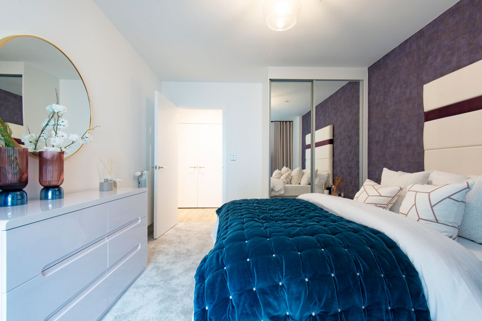 Modern, interior designed, bedroom, primarily white with blue accents
