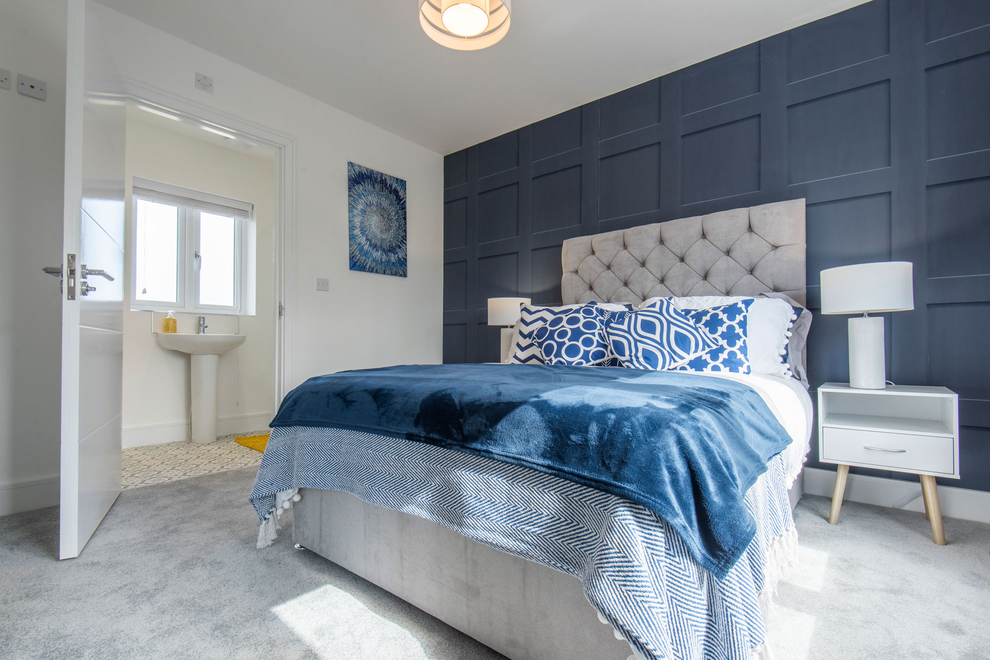 View of a contemporary bedroom showing the adjoining en suite