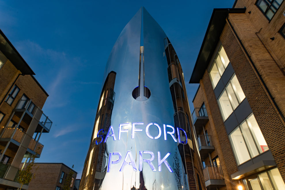 Striking, illuminated chrome sign for Stafford Park housing development