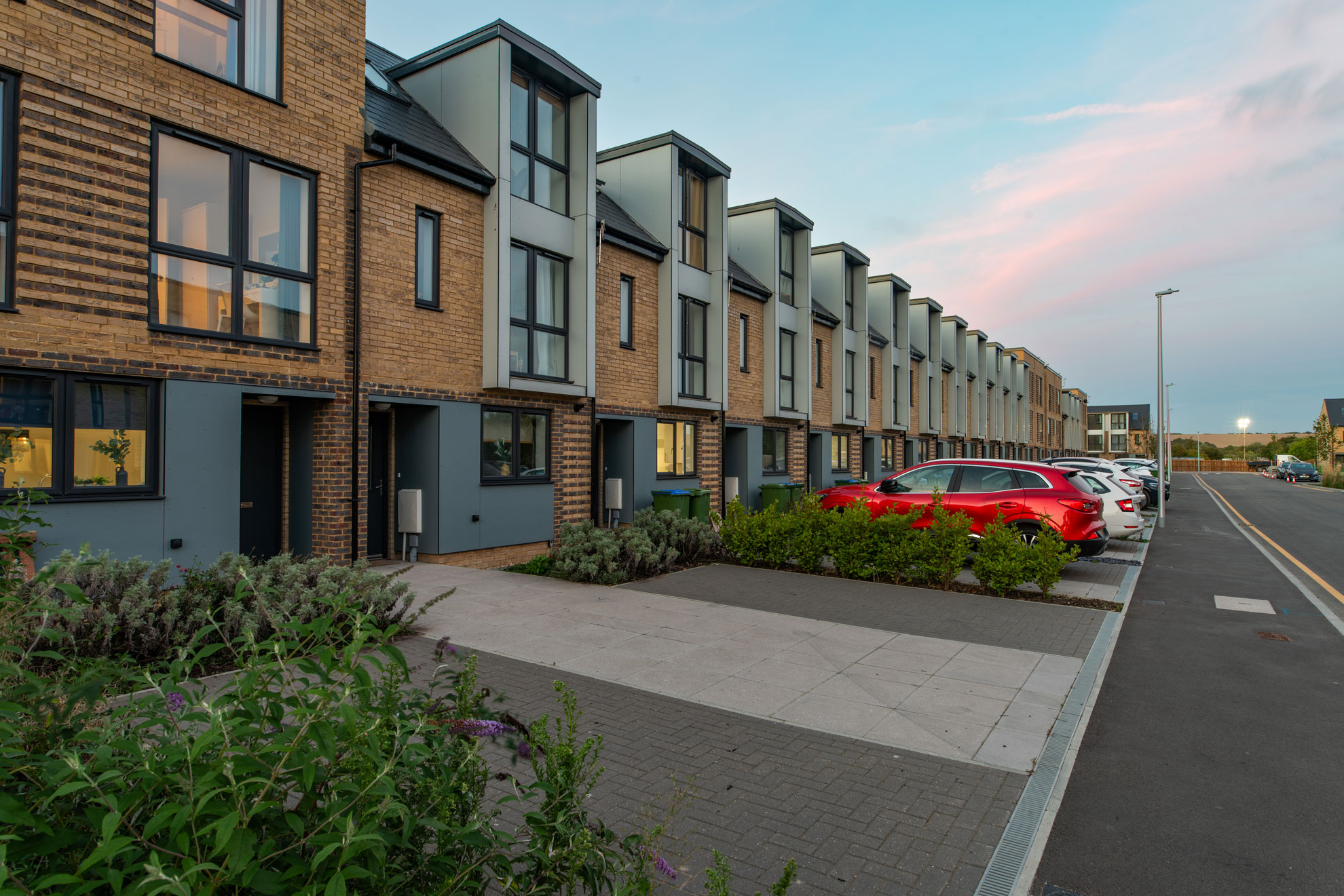 Streetview of modern townhouses at dusk