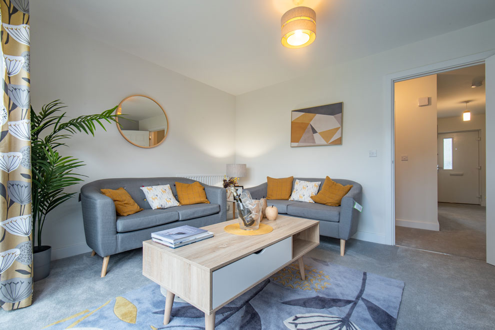 Interior photography of a modern living room with neutral colours and mustard accents
